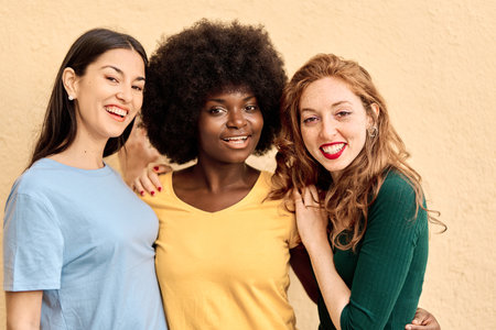 Close up portrait of multiethnic women smiling at cameraの写真素材