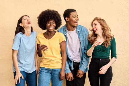 Studio portrait of happy multicultural people laughingの写真素材
