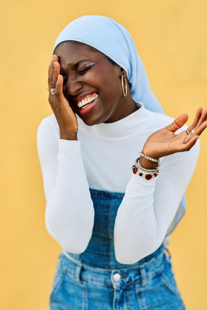 African muslim woman with hijab laughing happilyの写真素材