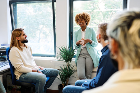 African woman talking during a relaxed meeting on a coworkingの写真素材