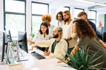 Meeting in front of the computer in a coworkingの写真素材