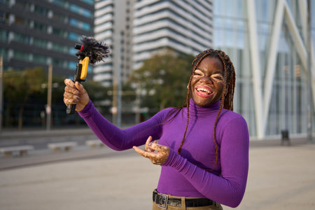 Jubilant African American Woman Making Video Blogの写真素材