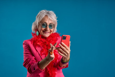 Joyful senior engaging with new technology