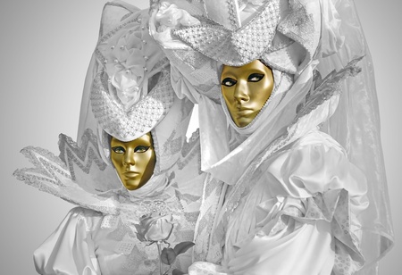 Woman and man with silver dress in the carnival of Venice, Italy.の写真素材
