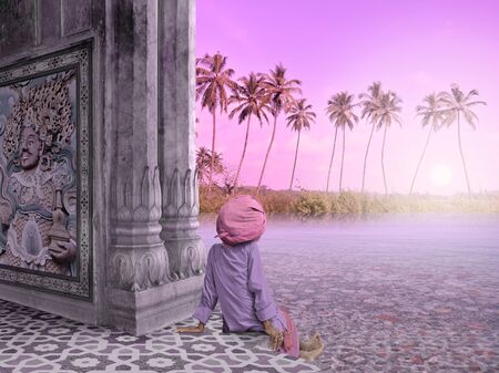 Holy man in a paradise in the south of India.の写真素材