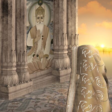 Woman with saree in a hindu temple during the sunset.の写真素材