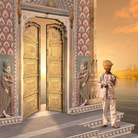 Indian man with a typical instrument in the sunset.の写真素材