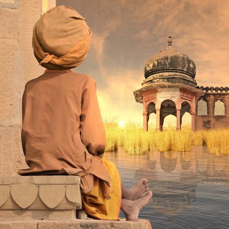 Indian man on the Ganges river during the sunset.の写真素材