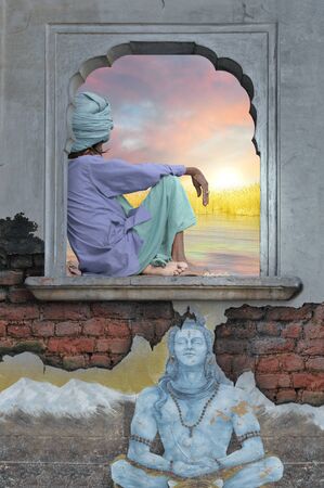 Holy man on a window during the sunrise.の写真素材