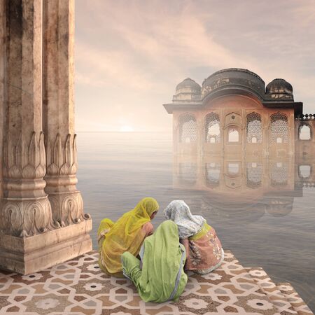 Indian women doing a ritual in a hindu temple.の写真素材