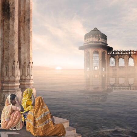 Indian women in a hindu temple in the mist.の写真素材