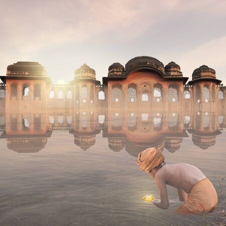 Indian man with a candle on the water in the mist.の写真素材
