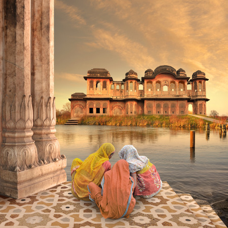 Women near traditional indian architecture on the Ganges.の写真素材