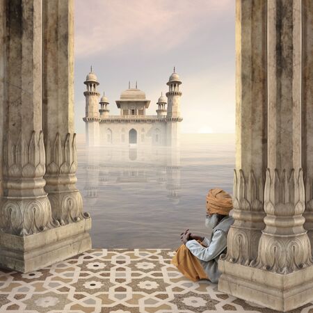 Senior in a hindu temple during the sunrise.の写真素材