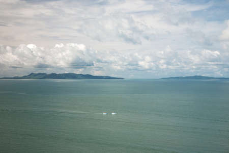 Beautiful cloudy sea view with islandの写真素材