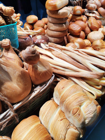 Various types of farm appetizing smoked products displayed at a market