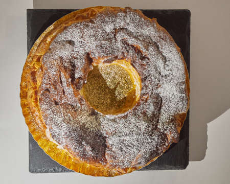 "Roscon de San Valero" stuffed with cream in a black slate board. Top view.の写真素材