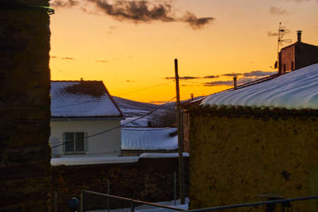 Snow covered houses on winterの写真素材