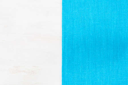 Blue napkin on the white wooden tableの写真素材