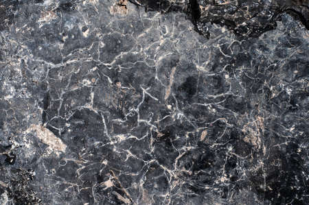 Abstract black obsidian background with cracksの写真素材