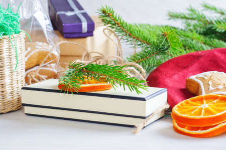 Gift boxes,  Gingerbreads  and Christmas tree branches on the wooden backgroundの写真素材