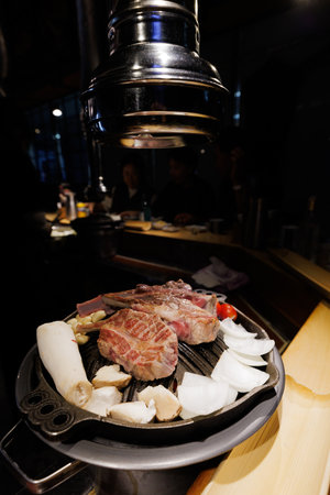 Korean BBQ Beef on Table Grill with Mushrooms and Vegetablesの写真素材