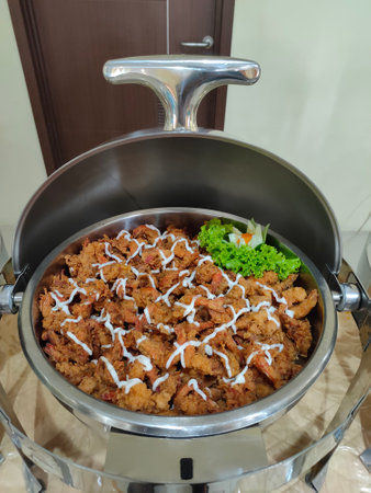 Thai style fried pork in a stainless steel potの写真素材
