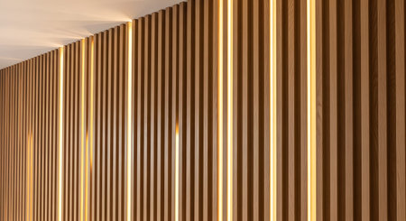 Integrated showing wood slat wall with integrated warm led lighting casting soft light and...