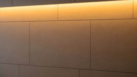Warm horizontal light highlights a textured wood-grain wall with clean horizontal paneling and...