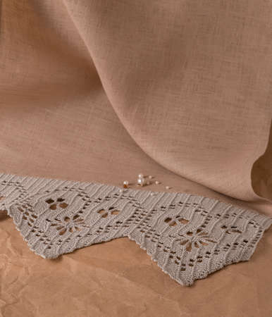 white scarf in a dark box. close-up