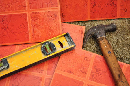 Terracotta-colored ceramic floor tiles ready for paving