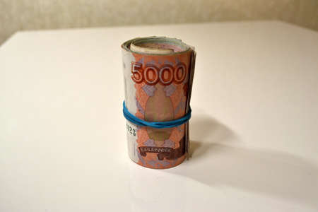 A little bit of money and bank notes and coins on the tableの写真素材