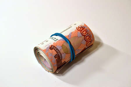 A little bit of money and bank notes and coins on the tableの写真素材