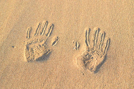 Fottprint sand on the beach oceanの写真素材