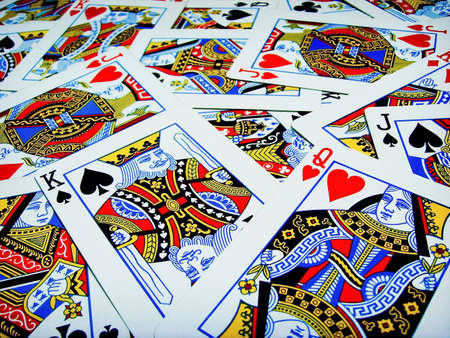 Cards of king queen and jacks scatterd on the tableのeditorial素材