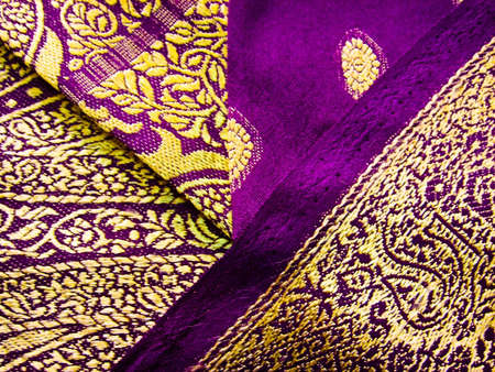 A purple and yellow indian traditional outfit known as a saree/sariの写真素材