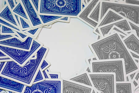 Blue and grey playing cards on a white backgroundのeditorial素材