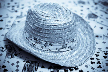 A cowboy hat placed on cards in seleniumのeditorial素材