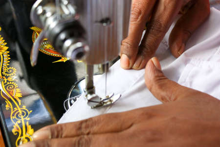 Sewing on a old antique traditional manual sewing machine