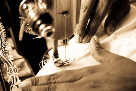 Sewing on a old antique sewing machineの写真素材