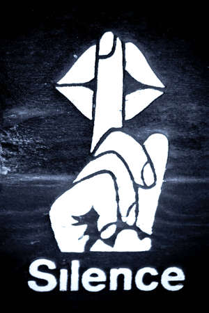 A sign that says to keep quiet or remain silentの写真素材