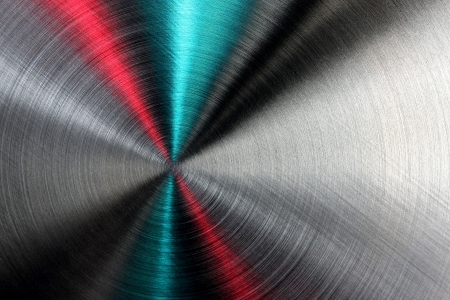 Shiny abstract metallic texture with blue, red and silver ray patterns.の写真素材