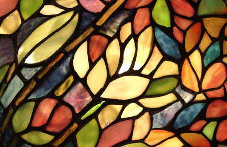 Glass art with backlit pattern in vibrant colorsの写真素材