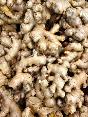 A close up photo of ginger is being sold on fresh ingredient marketの写真素材