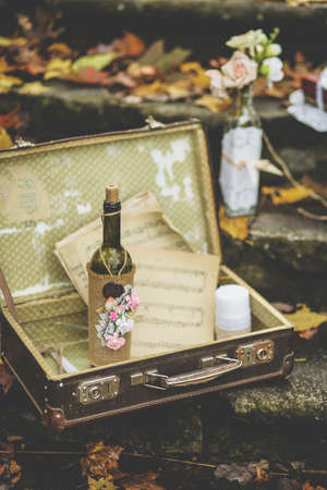 Decorating in retro style for weddings, anniversary in the autumn forest. Toned image.の写真素材