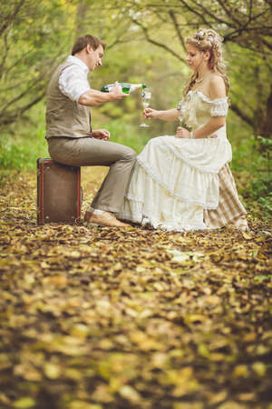 Decorating in retro style for weddings, anniversary in the autumn forest. Toned image.の写真素材