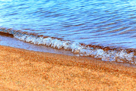 Blue clear water. Sea, lake, sun, beach, vacation Background for inserting images and text. Tourism, travel.の写真素材