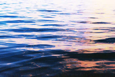 Blue clear water. Sea, lake, sun, beach, vacation Background for inserting images and text. Tourism, travel.の写真素材