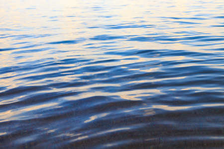 Blue clear water. Sea, lake, sun, beach, vacation Background for inserting images and text. Tourism, travel.の写真素材