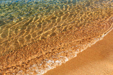 Blue clear water. Sea, lake, sun, beach, vacation Background for inserting images and text. Tourism, travel.の写真素材